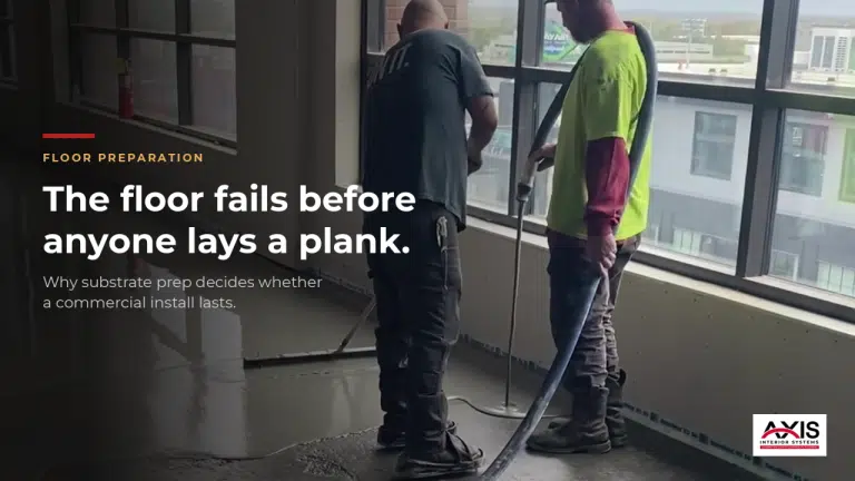 Construction workers preparing a concrete subfloor in a commercial building.