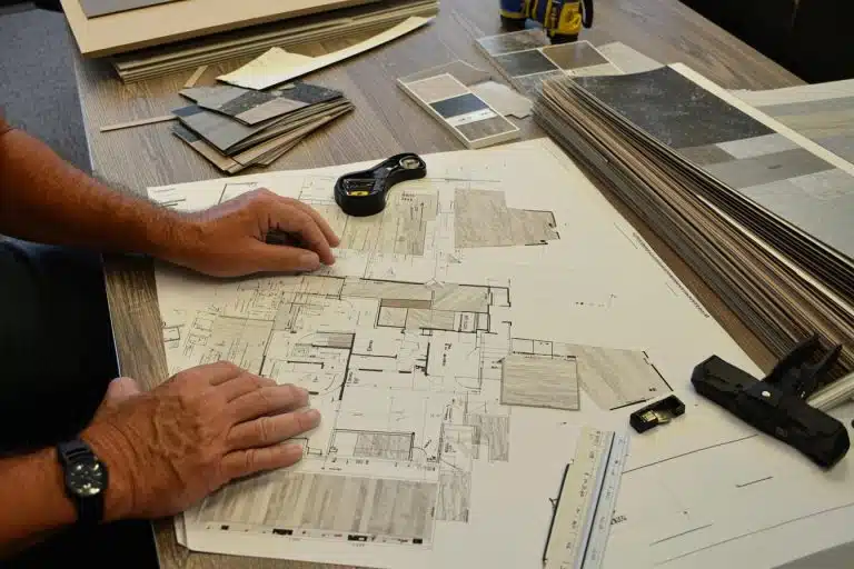 “Flooring professionals reviewing material samples and project plans.”
